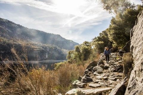 Caucasian mother carrying daughter in Yosemite National Park