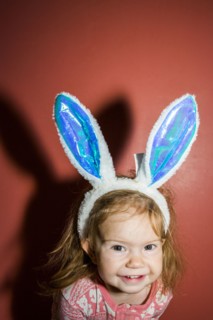 Caucasian baby girl wearing bunny ears