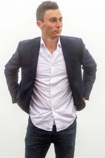 Caucasian man standing in fog
