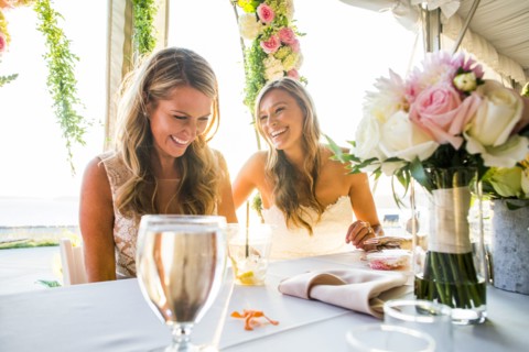 Caucasian brides sitting at table