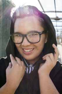 Portrait of smiling androgynous Asian woman
