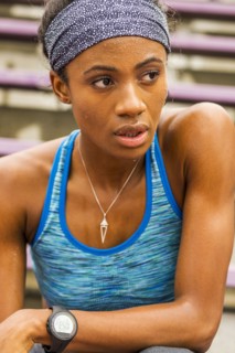 Serious Black athlete sweating