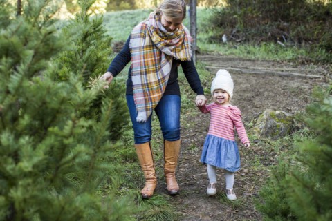 Caucasian mother and daughter walking on path