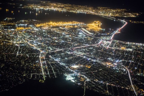 Aerial view of illuminated city at night
