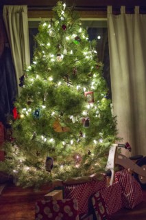 Gifts under illuminated Christmas tree
