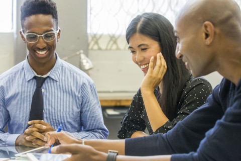 People laughing in meeting