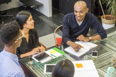 Smiling people talking in meeting