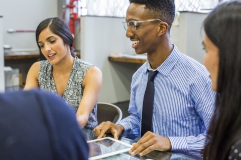 Smiling people talking in meeting
