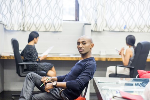Portrait of serious African American man sitting in office