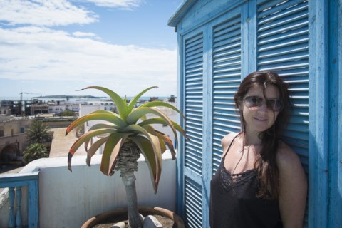 Caucasian woman standing on urban balcony
