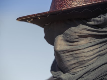 Close up of Caucasian traveler wearing face scarf