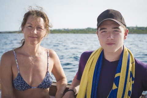 Caucasian mother and son on boat