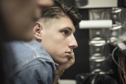 Close up profile of leaning Caucasian man