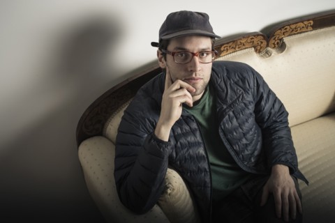 Caucasian man sitting on sofa
