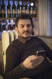 Caucasian man using cell phone