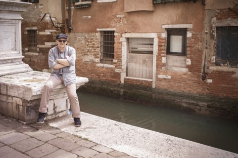 Caucasian tourist standing on canal waterfront