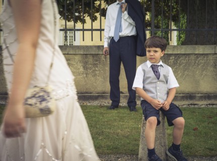 Bored boy wearing formal clothing at event