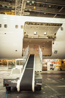 Conveyor belt leading to airplane cargo hold