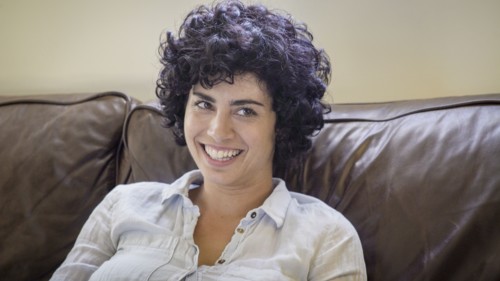 Caucasian woman smiling on sofa