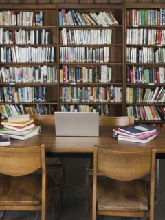 Empty chairs and table in library