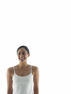Waist up view of smiling woman standing