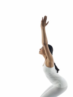 Side view of serene woman practicing yoga