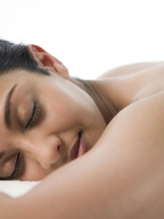 Close up of woman laying on massage table