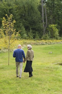 Older couple walking in park