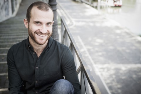 Caucasian man sitting on outdoor staircase
