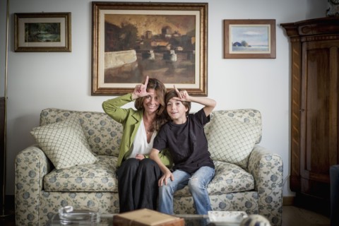 Caucasian grandmother and grandson gesturing loser