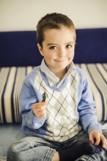 Caucasian boy holding toy soldier