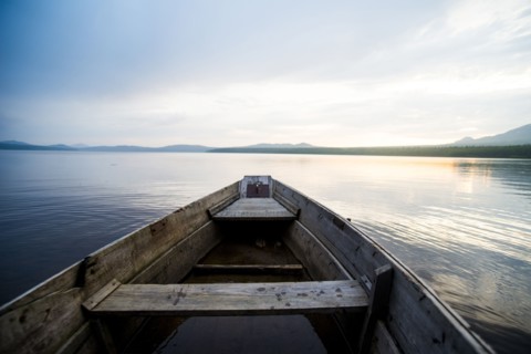 Dilapidated boat on remote lake