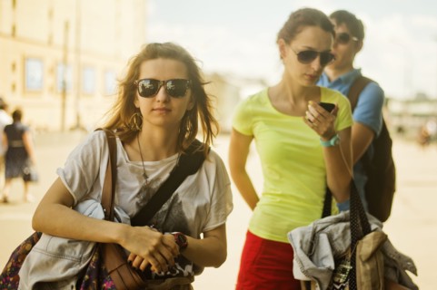 Caucasian women carrying bags outdoors