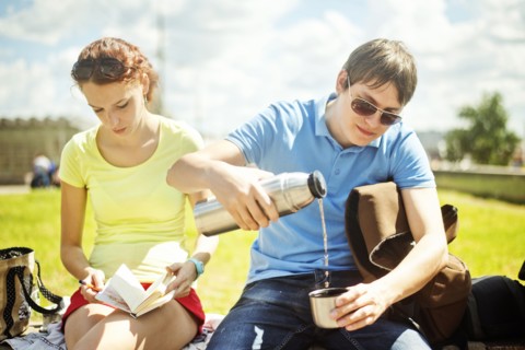 Caucasian couple relaxing in park