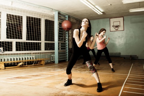 Caucasian dancers rehearsing in gym