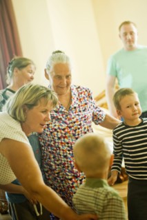 Caucasian multi-generation family relaxing indoors