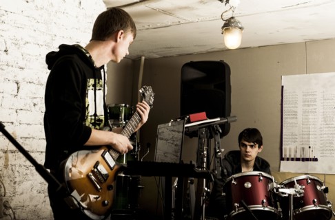 Caucasian musicians playing in rock band
