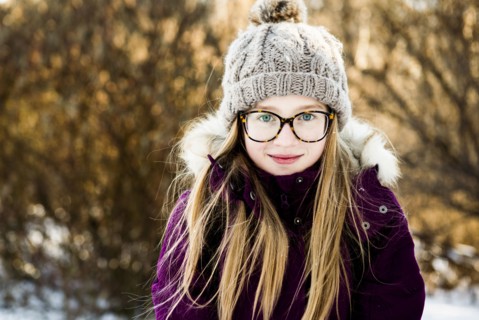 Caucasian girl smiling outdoors in winter