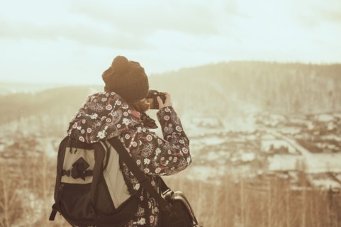 Caucasian woman photographing landscape