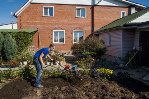 Caucasian man working in garden