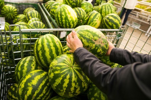 Caucasian woman shopping in grocery store