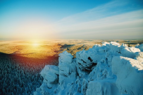 Snowy hilltop overlooking remote landscape