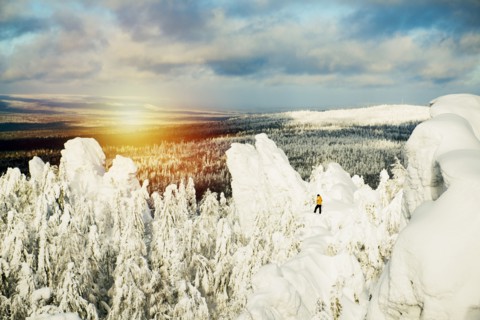 Hiker walking on snowy mountain