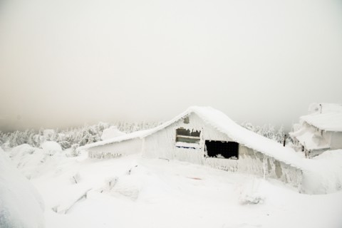 Weather station on snowy remote mountain