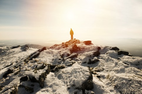 Woman hiking on mountain in winter