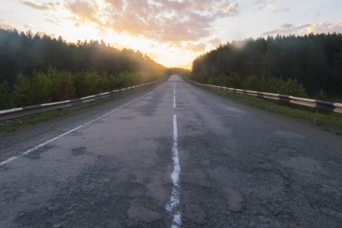 Sunset over empty freeway