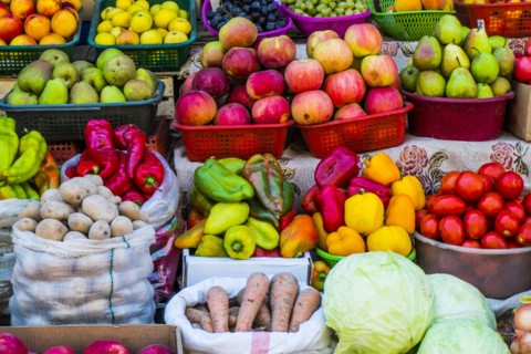 Variety of fresh fruit and vegetables at market
