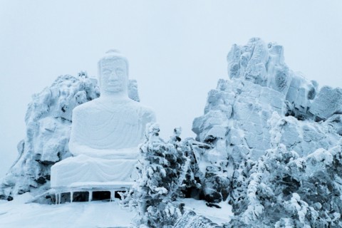 Snow on Buddha statue