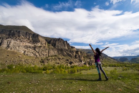 Carefree Caucasian woman admiring mountains