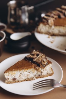 Slice of cheesecake on plate with fork